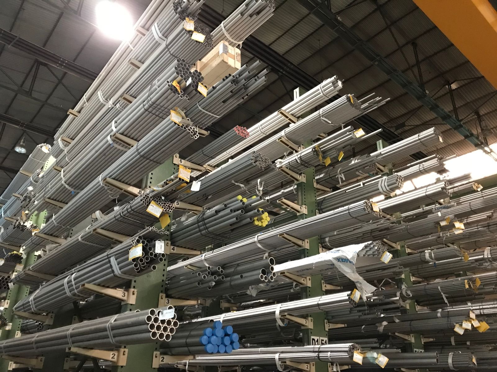 Stainless steel pipes stocked in warehouse racking
