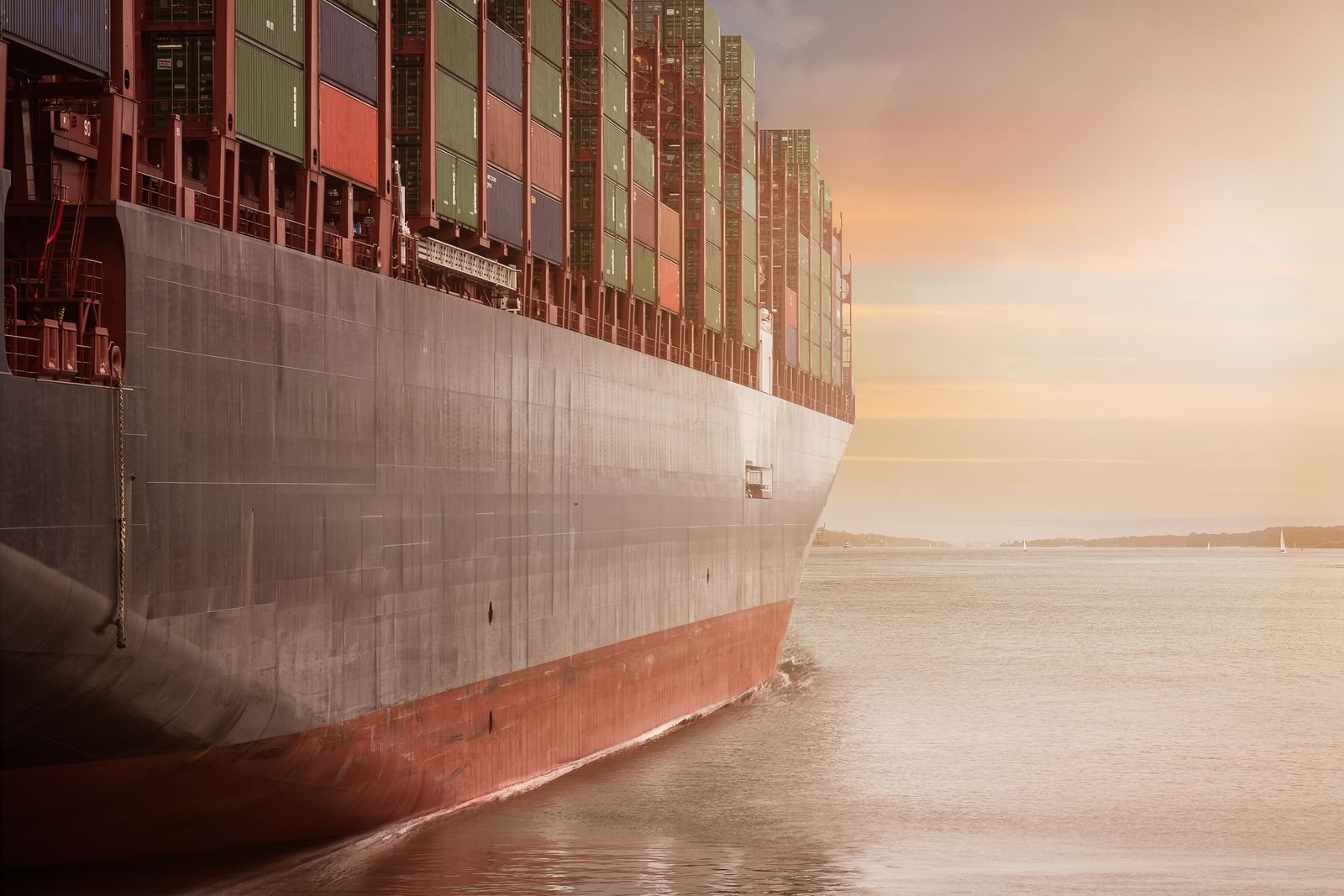 Container ship loaded for export, representing global ocean shipping of welded steel pipes